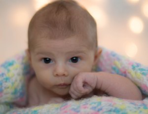 This picture was taken was taken during the first set.  She was wide awake, not quite fighting sleep, just being curious!